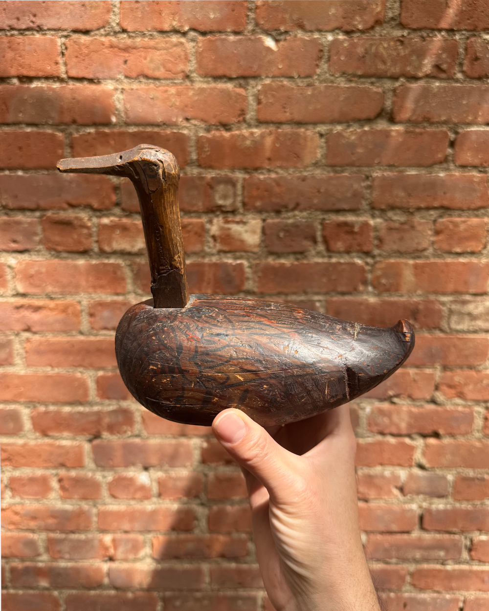 Ilya Milstein holding a wooden duck